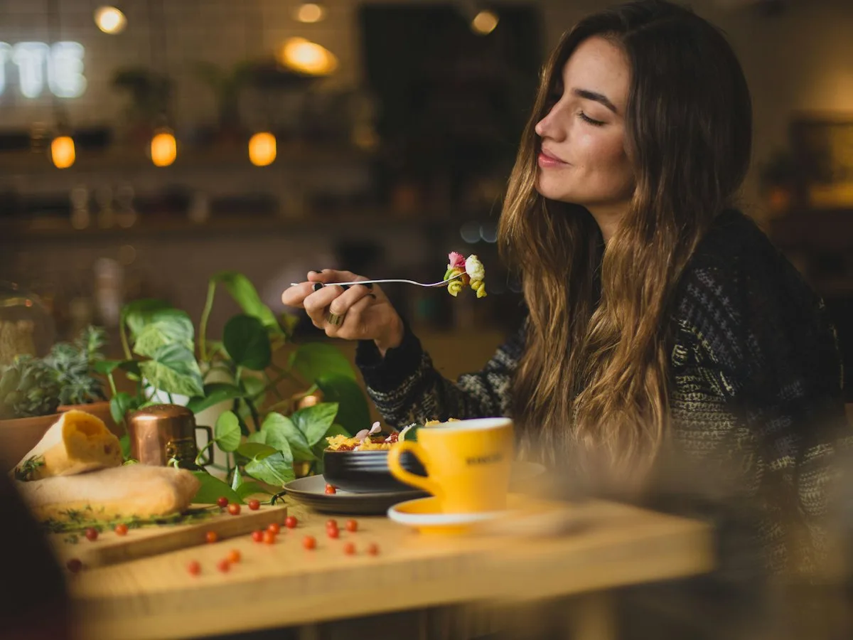 Guest enjoying a dish at a restaurant table